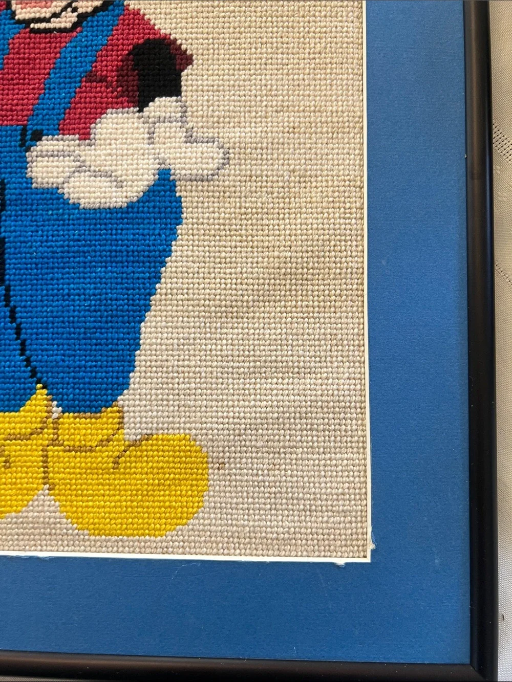 Framed and matted Handmade Cross-Stitch Mickey Mouse Artwork -